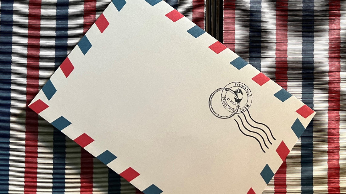 Our custom-designed airmail envelopes with the classic red and blue borders. Complemented with the rubber stamp printed in the top right corner of the airmail envelope. Accompaniment for our Vintage Travel Postcards.